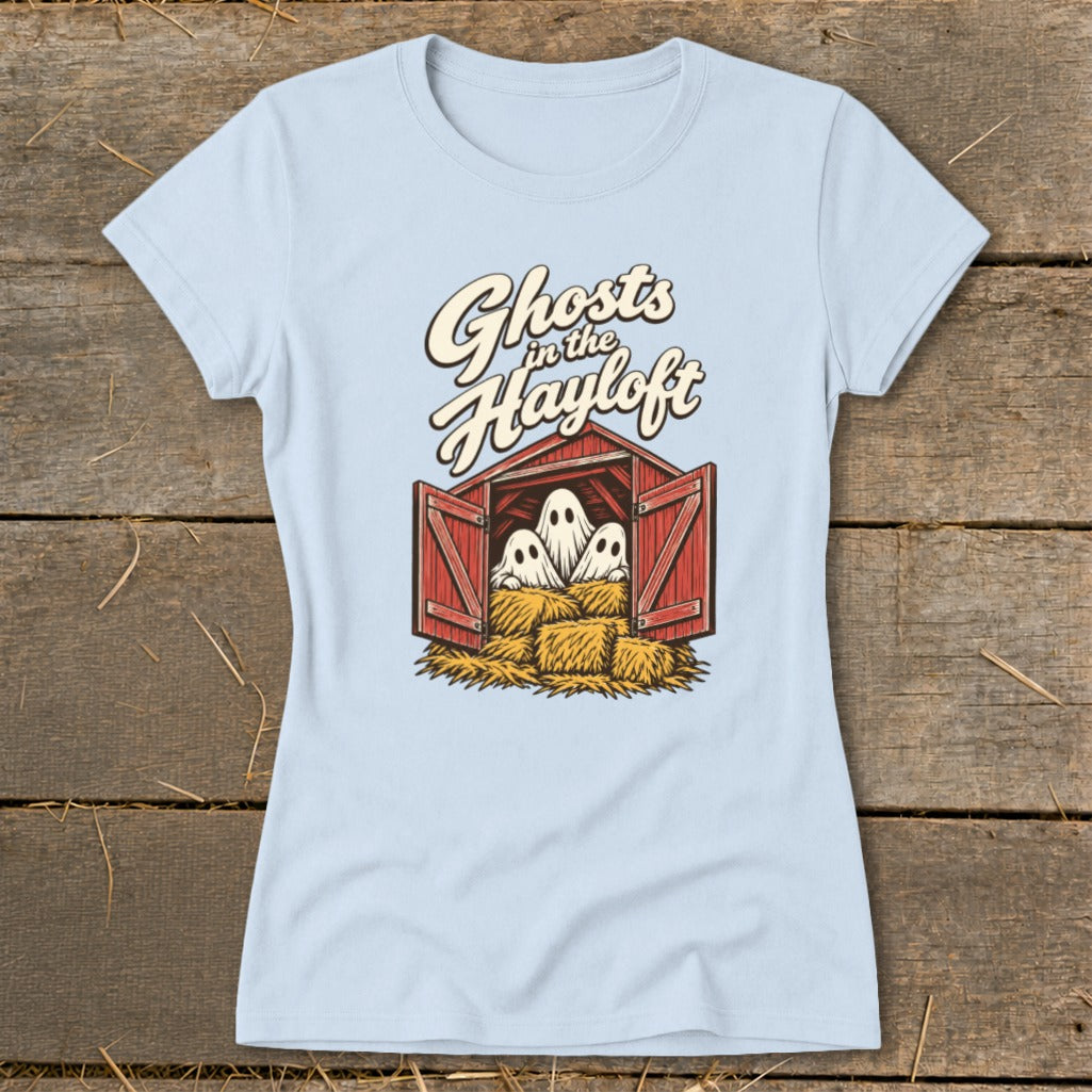 Light blue t-shirt with "Ghosts in the Hayloft" text above a barn with three ghosts on hay bales.