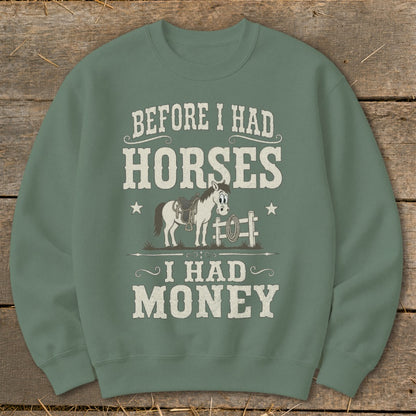 Green sweatshirt with cartoon horse and "Before I had horses, I had money" text.