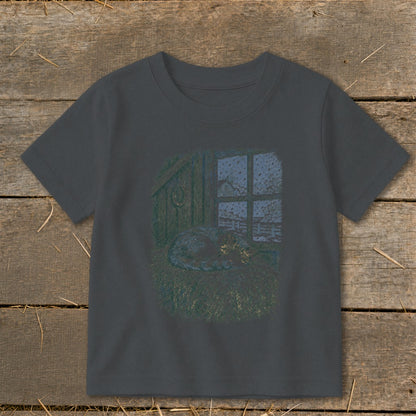 Cat sleeping on hay near window with snow outside, horseshoe on wall.