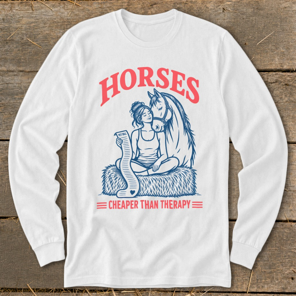 White long sleeve shirt with "Horses Cheaper Than Therapy" graphic and horse and rider.