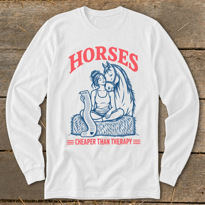 White long sleeve shirt with "Horses Cheaper Than Therapy" graphic and horse and rider.