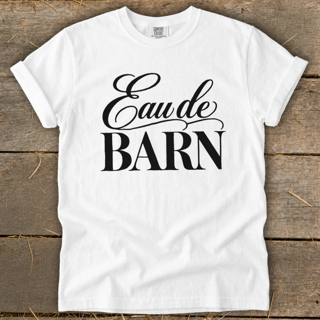 White t-shirt with black text "Eau de BARN".