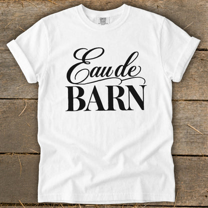 White t-shirt with black text "Eau de BARN".