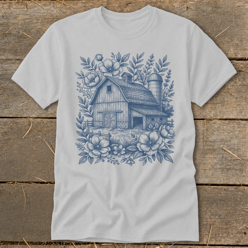 Barn with silo surrounded by flowers and foliage design.