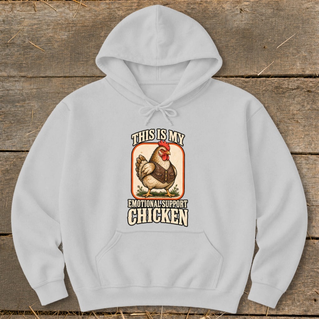 White hoodie with "This Is My Emotional Support Chicken" text and graphic.