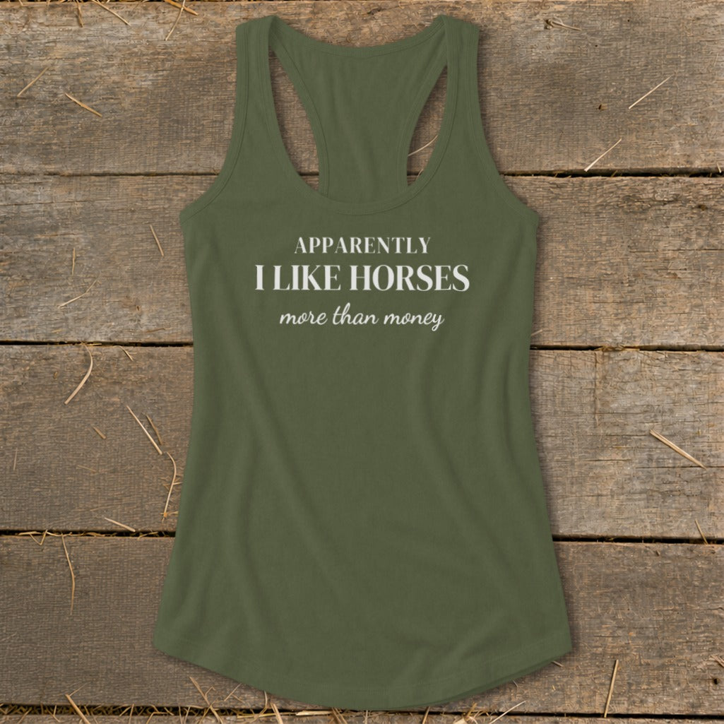 Olive green racerback tank top with white text that reads "APPARENTLY I LIKE HORSES more than money".