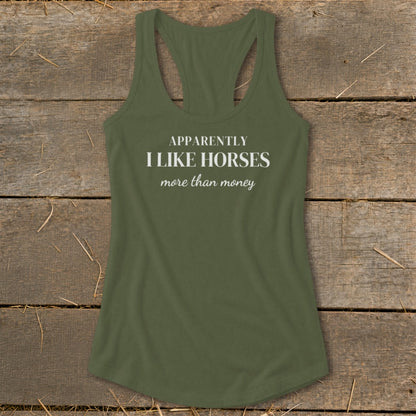 Olive green racerback tank top with white text that reads "APPARENTLY I LIKE HORSES more than money".