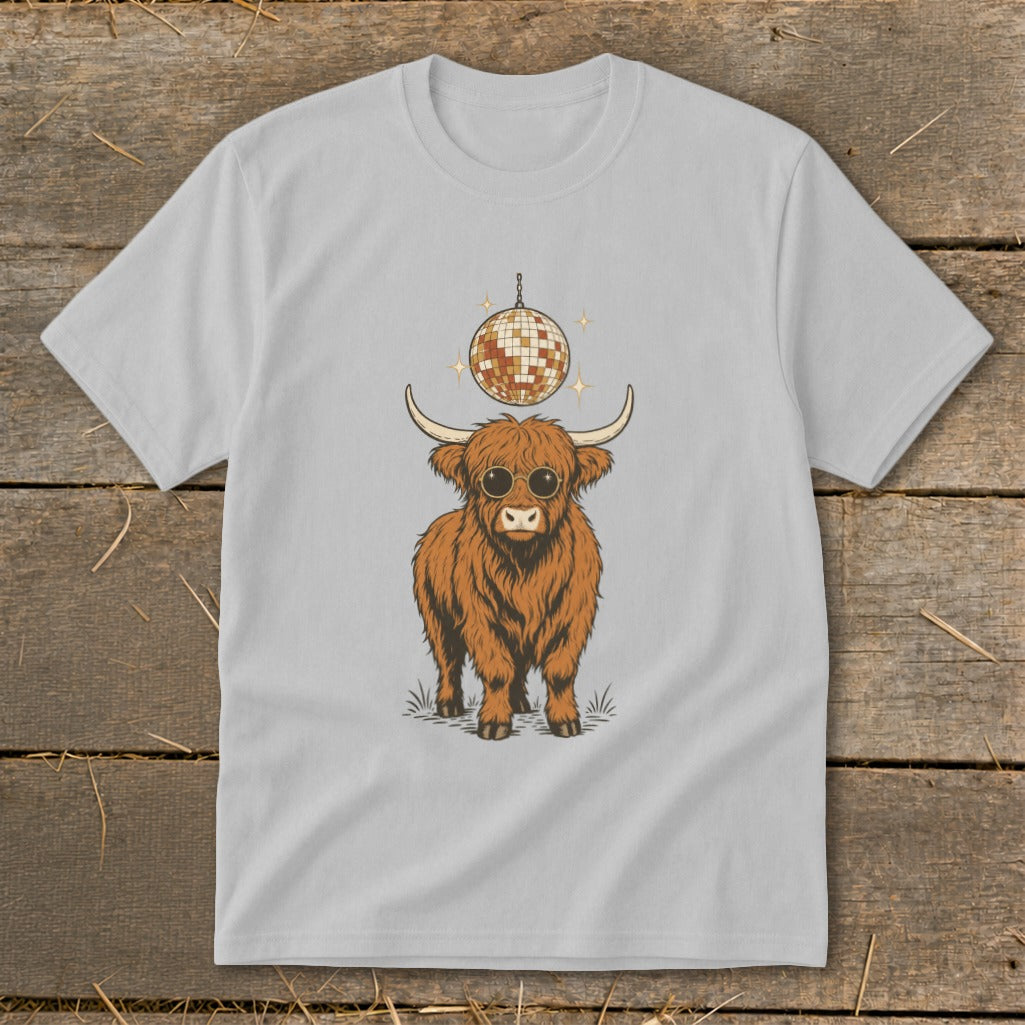 Highland cow with sunglasses and disco ball graphic on a light gray t-shirt.