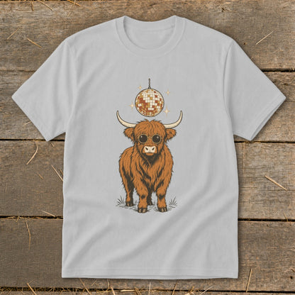 Highland cow with sunglasses and disco ball graphic on a light gray t-shirt.