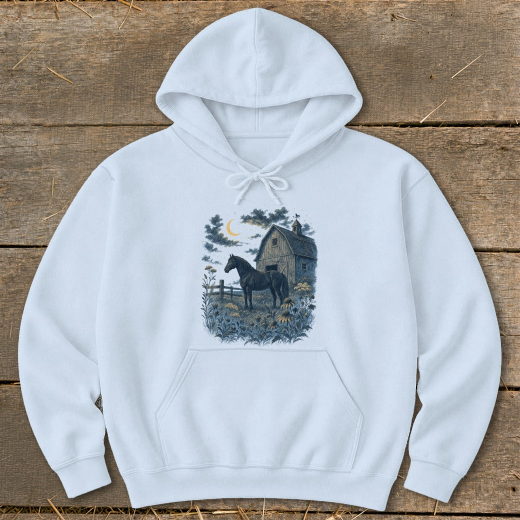 Light blue hoodie with a dark horse in front of a barn at night.