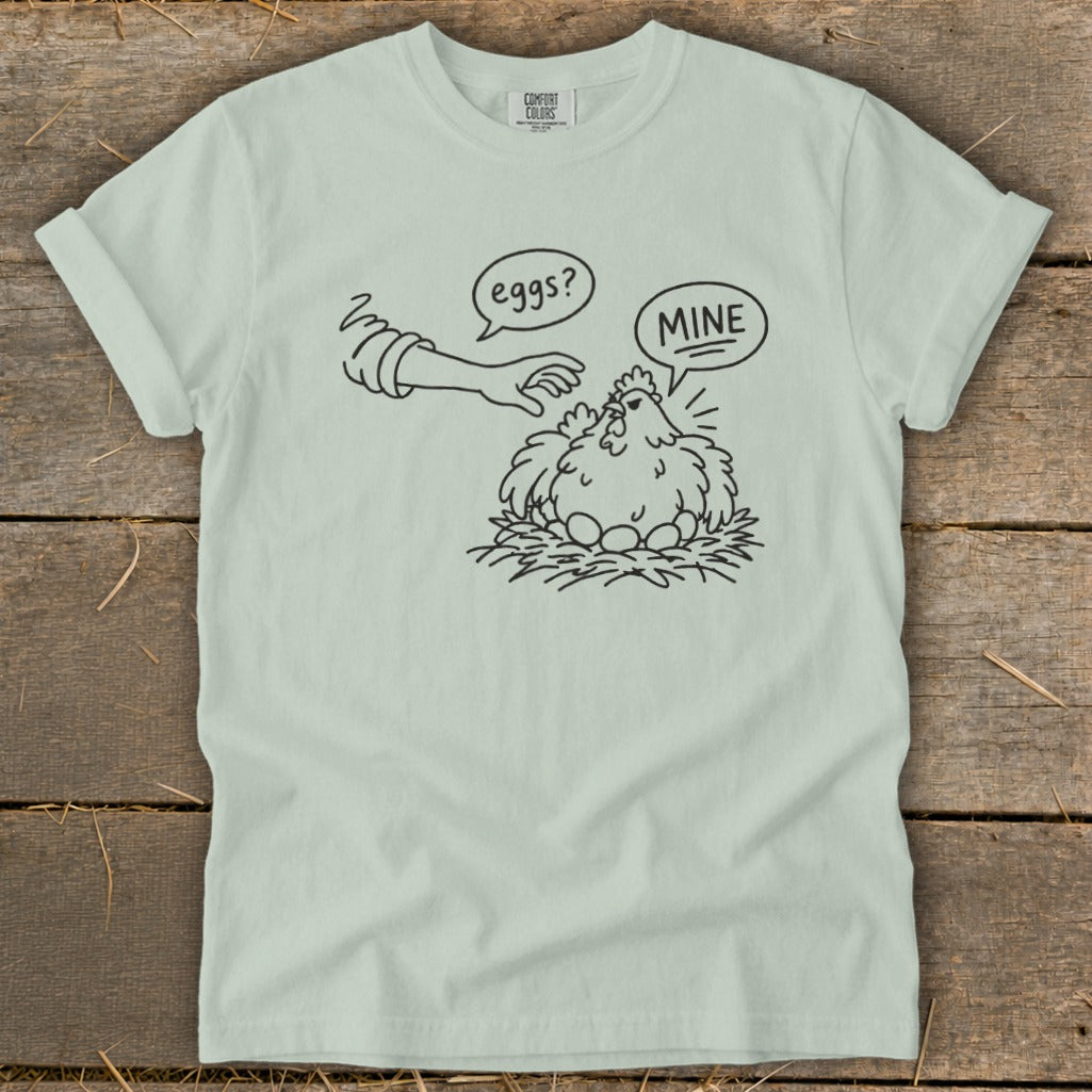 Line drawing of a chicken protecting eggs with speech bubbles saying "eggs?" and "MINE".