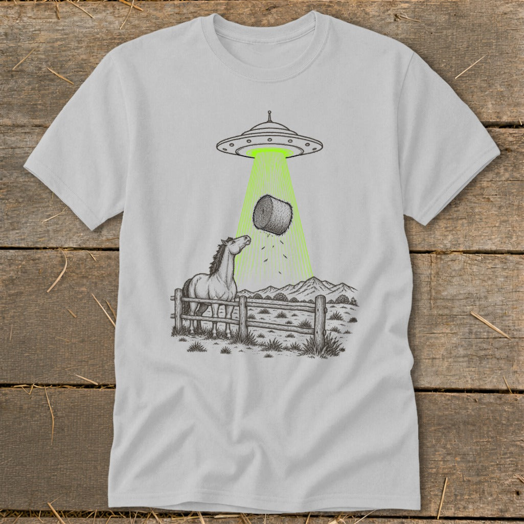 UFO beaming a hay bale down onto a surprised horse in a fenced pasture.