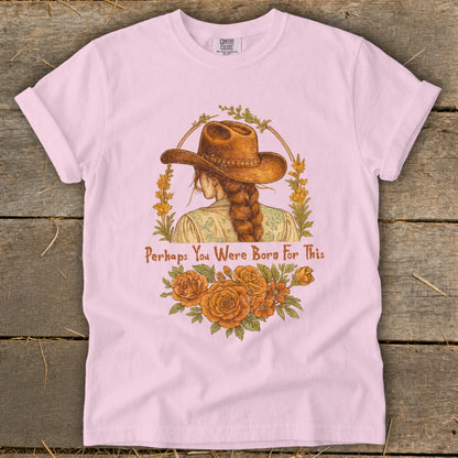 Pink t-shirt with illustration of woman in cowboy hat, text "Perhaps You Were Born For This".