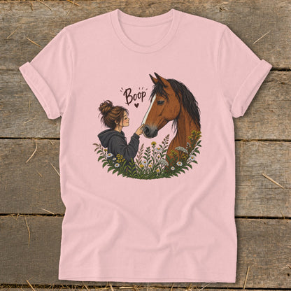 Illustration of girl booping horse nose with text "Boop" and heart.
