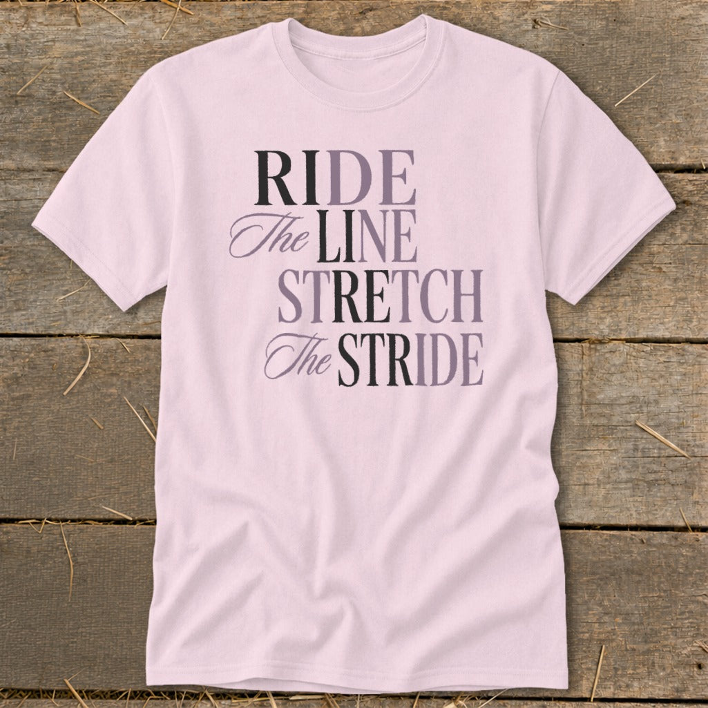 Light pink t-shirt with text "RIDE The LINE STRETCH The STRIDE".