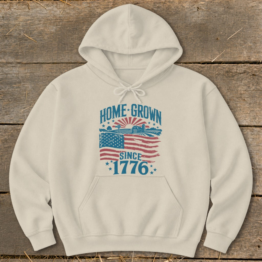 Cream hoodie with "HOME GROWN SINCE 1776" graphic featuring American flag and farm scene.