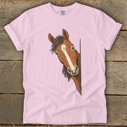 Pink t-shirt with a brown horse head peeking from the side.