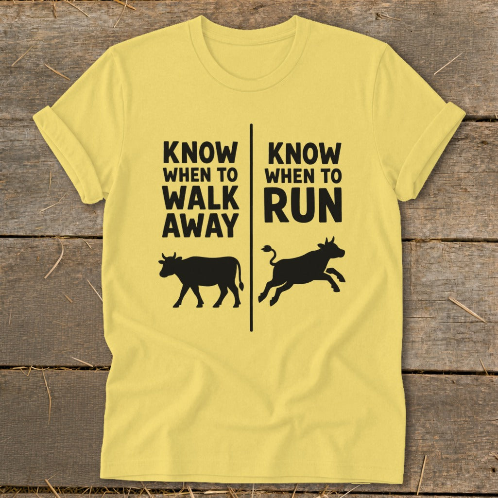 Yellow t-shirt with black text "Know When to Walk Away" and a cow, and "Know When to Run" and a running cow.