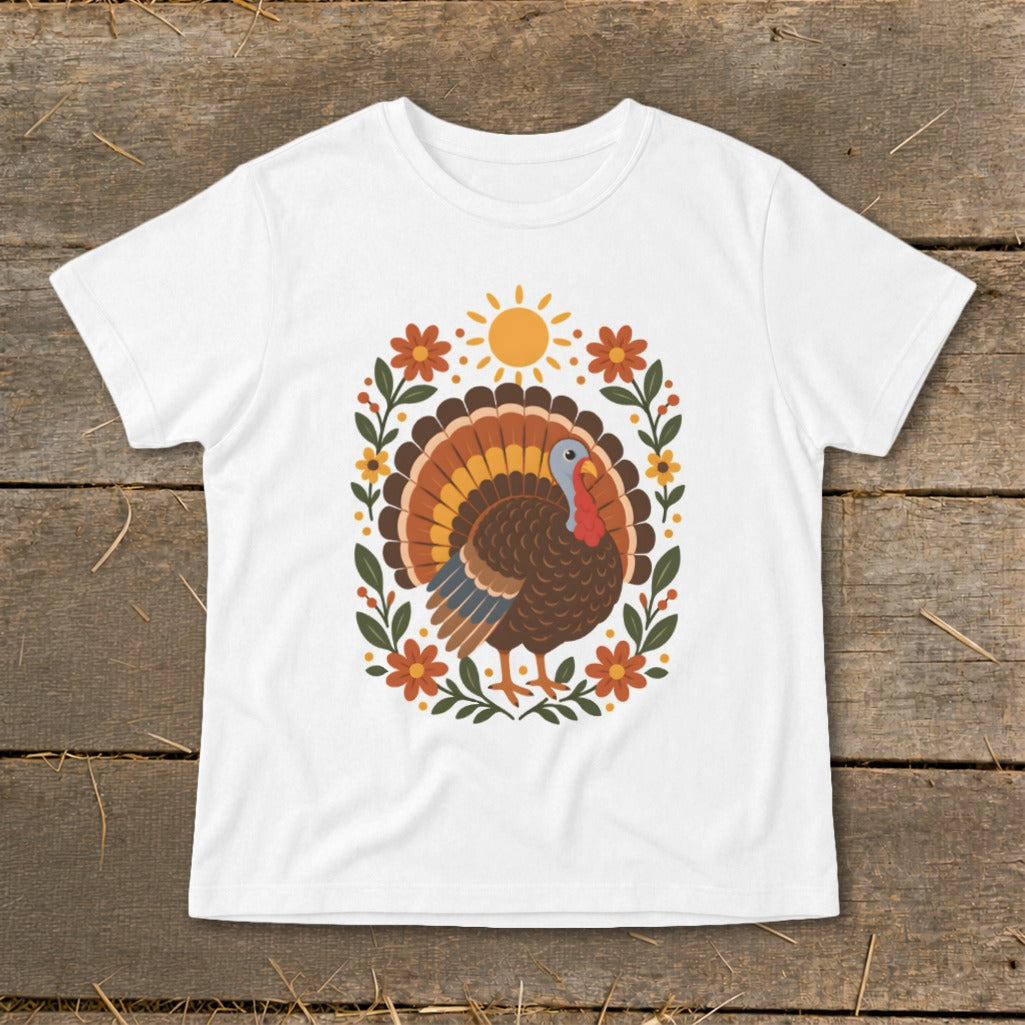 White t-shirt with a graphic of a turkey surrounded by flowers and a sun.