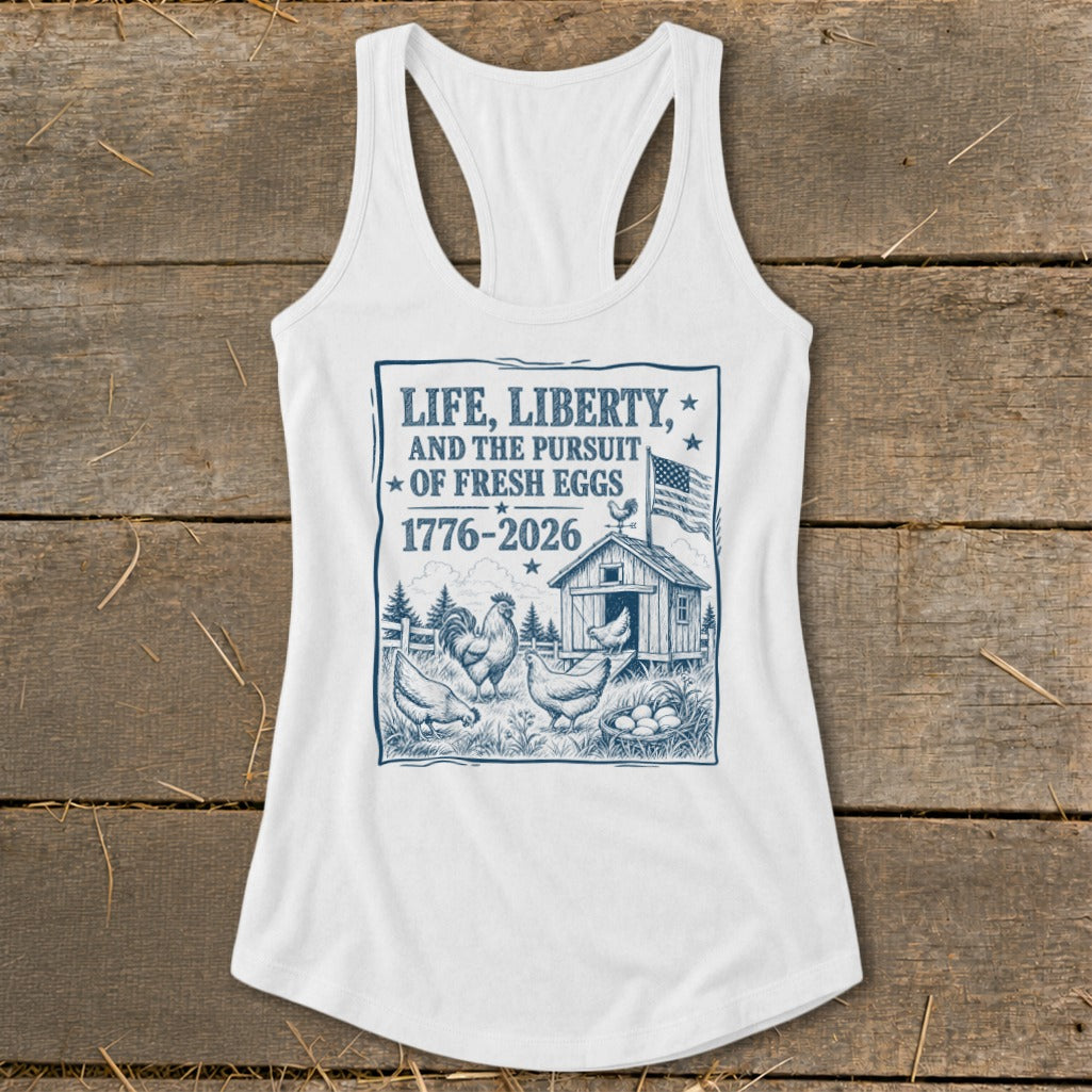 White tank top with "Life, Liberty, and the Pursuit of Fresh Eggs" graphic.