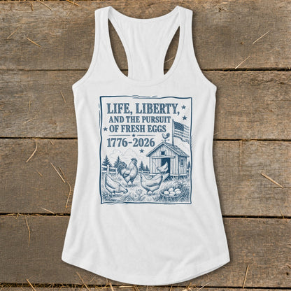 White tank top with "Life, Liberty, and the Pursuit of Fresh Eggs" graphic.