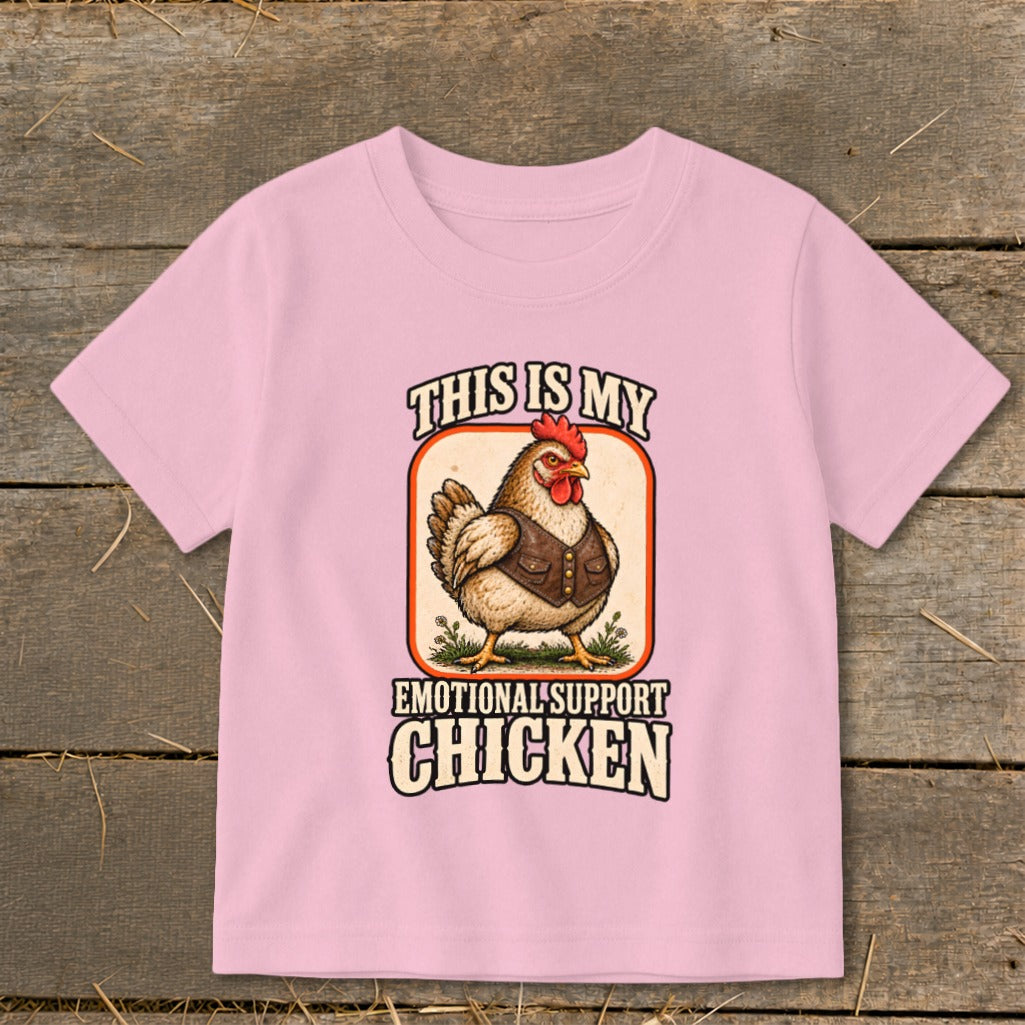 Pink t-shirt graphic with a chicken wearing a vest and text "This is my emotional support chicken".