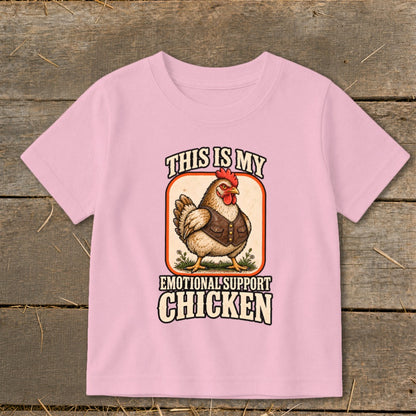 Pink t-shirt graphic with a chicken wearing a vest and text "This is my emotional support chicken".