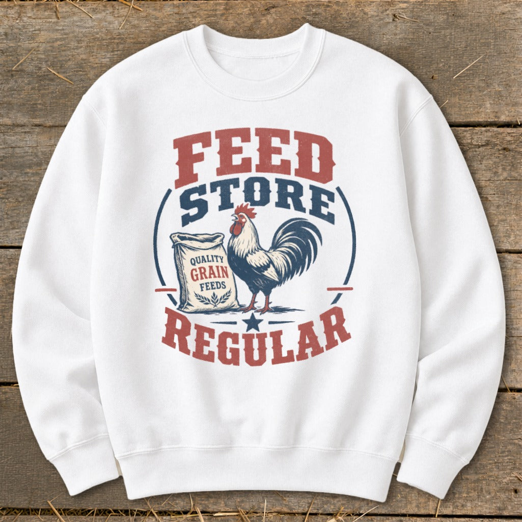 White sweatshirt with a "Feed Store Regular" graphic featuring a rooster and bag of grain.