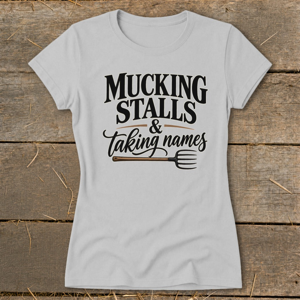 Grey t-shirt with "Mucking Stalls & Taking Names" text and a pitchfork graphic.