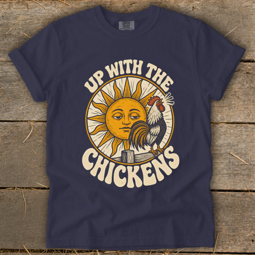 Dark blue t-shirt featuring a retro graphic of a rooster crowing next to a sleepy sun and the text "Up With The Chickens".