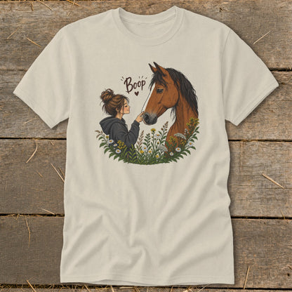 Illustration of a girl booping a horse's nose surrounded by flowers, with "Boop" text.