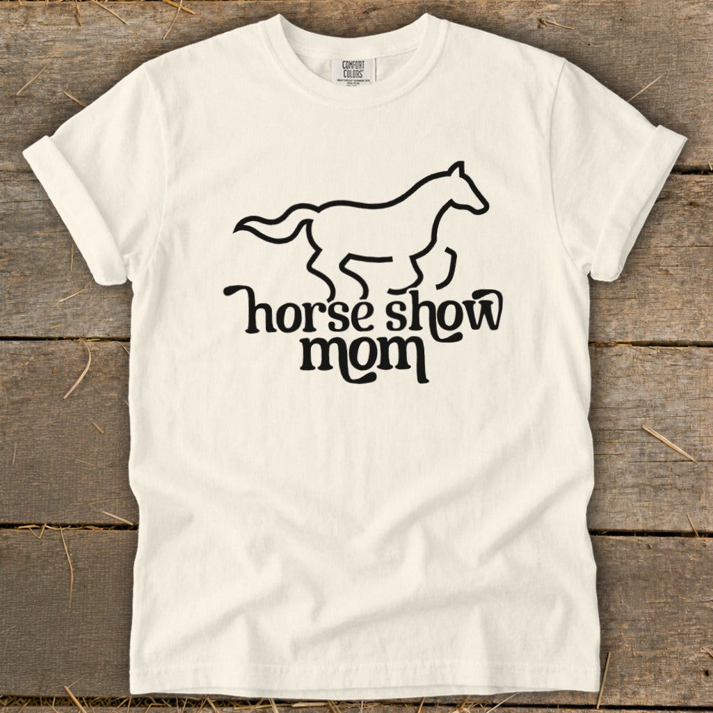 White t-shirt with black graphic of a running horse and text "horse show mom".
