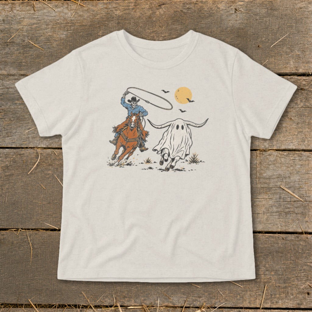 Skeleton cowboy on horseback chasing a longhorn ghost with bats and moon.