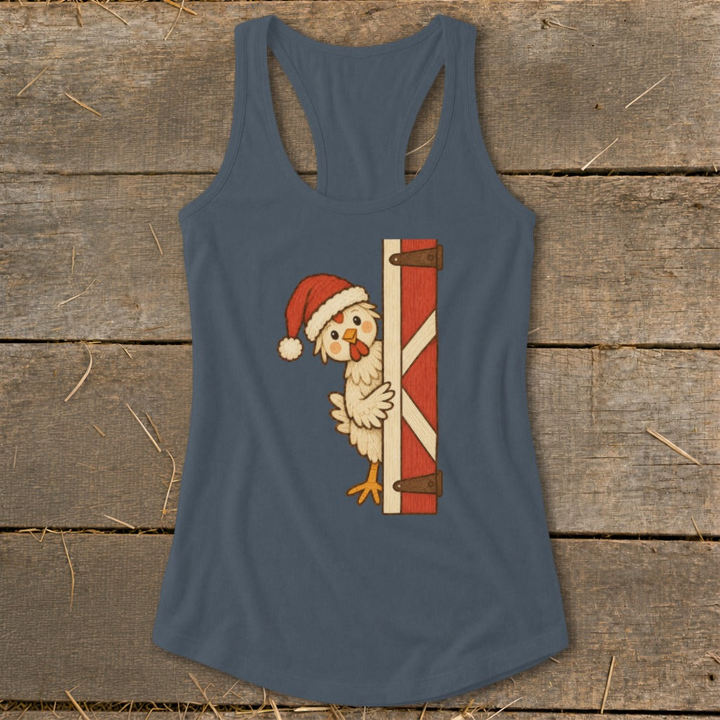 Chicken wearing Santa hat peeking from behind a red barn door.
