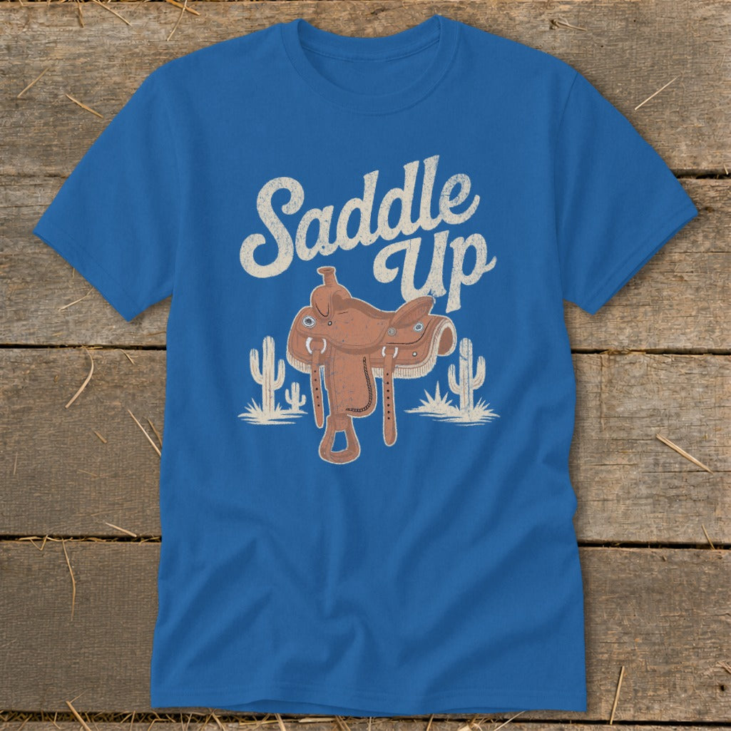 Blue t-shirt with "Saddle Up" text and a western saddle illustration.
