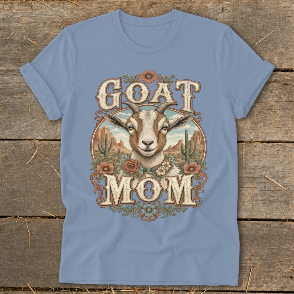 Light blue t-shirt with a goat illustration surrounded by desert scenery and text.