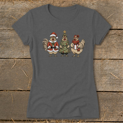 Three chickens dressed for Christmas: one as Santa, one as a tree, one with a gift.