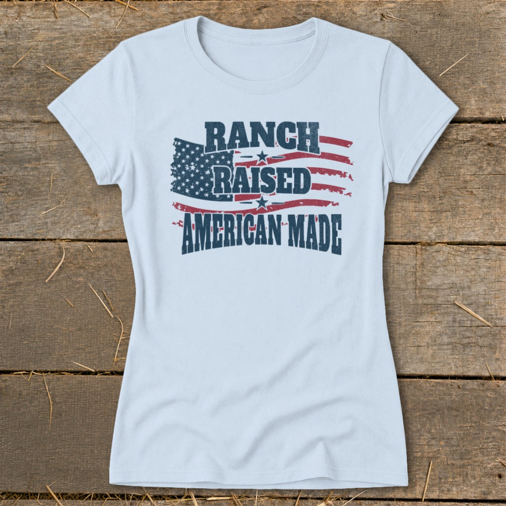 Light blue t-shirt with "Ranch Raised American Made" text and American flag graphic.