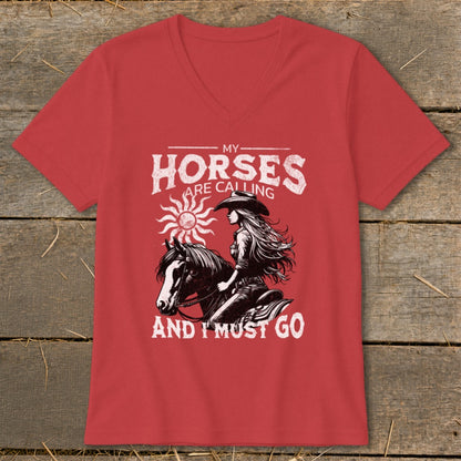 Red t-shirt with distressed graphic of cowgirl on horse, "My Horses Are Calling And I Must Go."