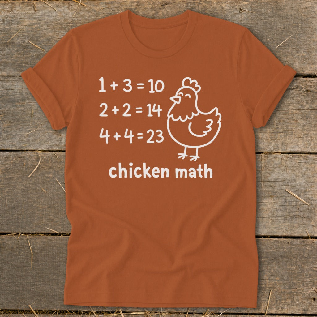 Orange t-shirt with white text and chicken graphic: "chicken math" and equations.