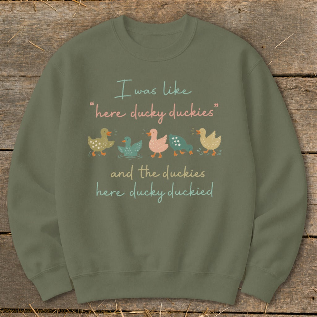 Green sweatshirt with text "I was like 'here ducky duckies' and the duckies here ducky duckied" and five ducks.
