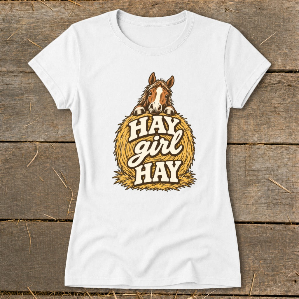White t-shirt with horse peeking over hay bale and text "HAY girl HAY".
