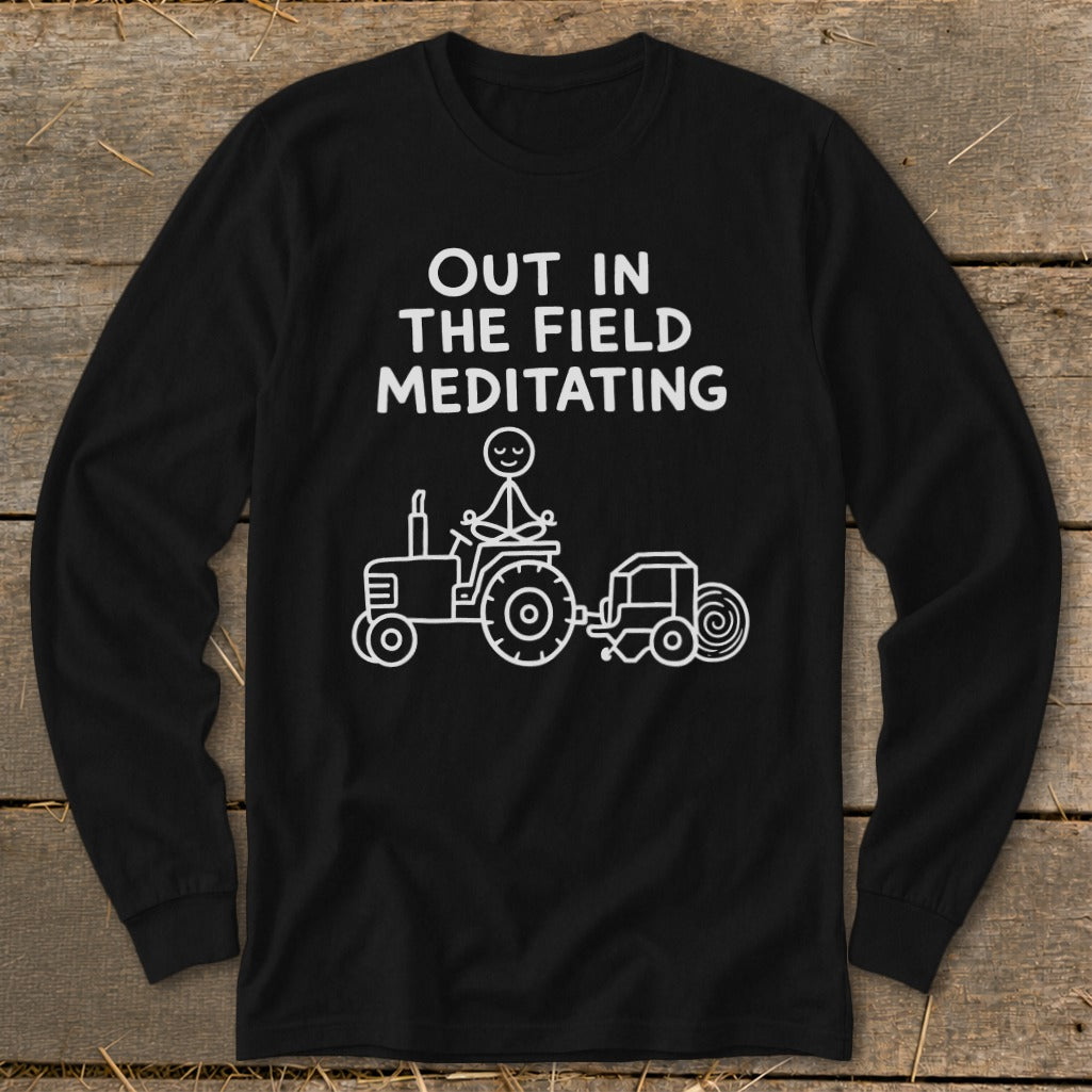 Black long-sleeve shirt with "Out in the field meditating" and a stick figure meditating on a tractor.