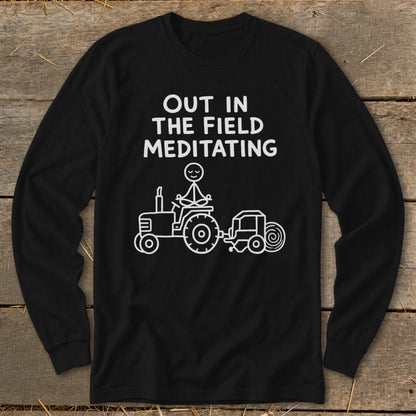 Black long-sleeve shirt with "Out in the field meditating" and a stick figure meditating on a tractor.