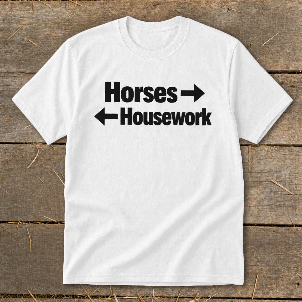A white crewneck t-shirt with black text reading Horses with a right arrow and Housework with a left arrow.