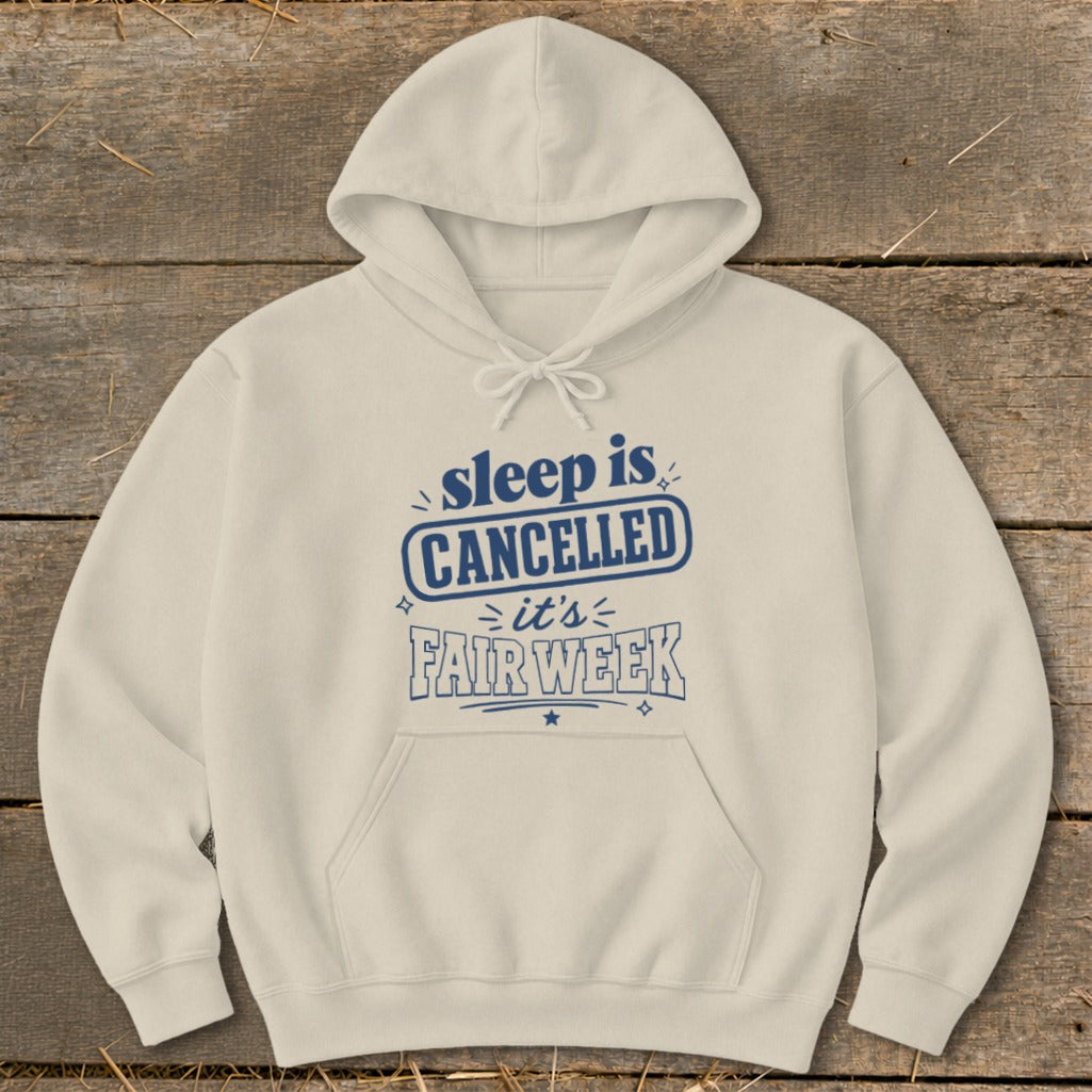 Cream hoodie with "sleep is CANCELLED it's FAIR WEEK" text design.