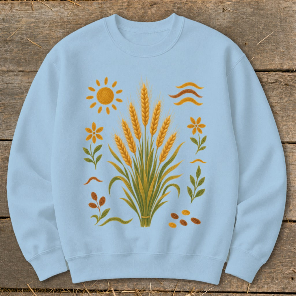 Light blue sweatshirt with a wheat stalk illustration, sun, and flowers.