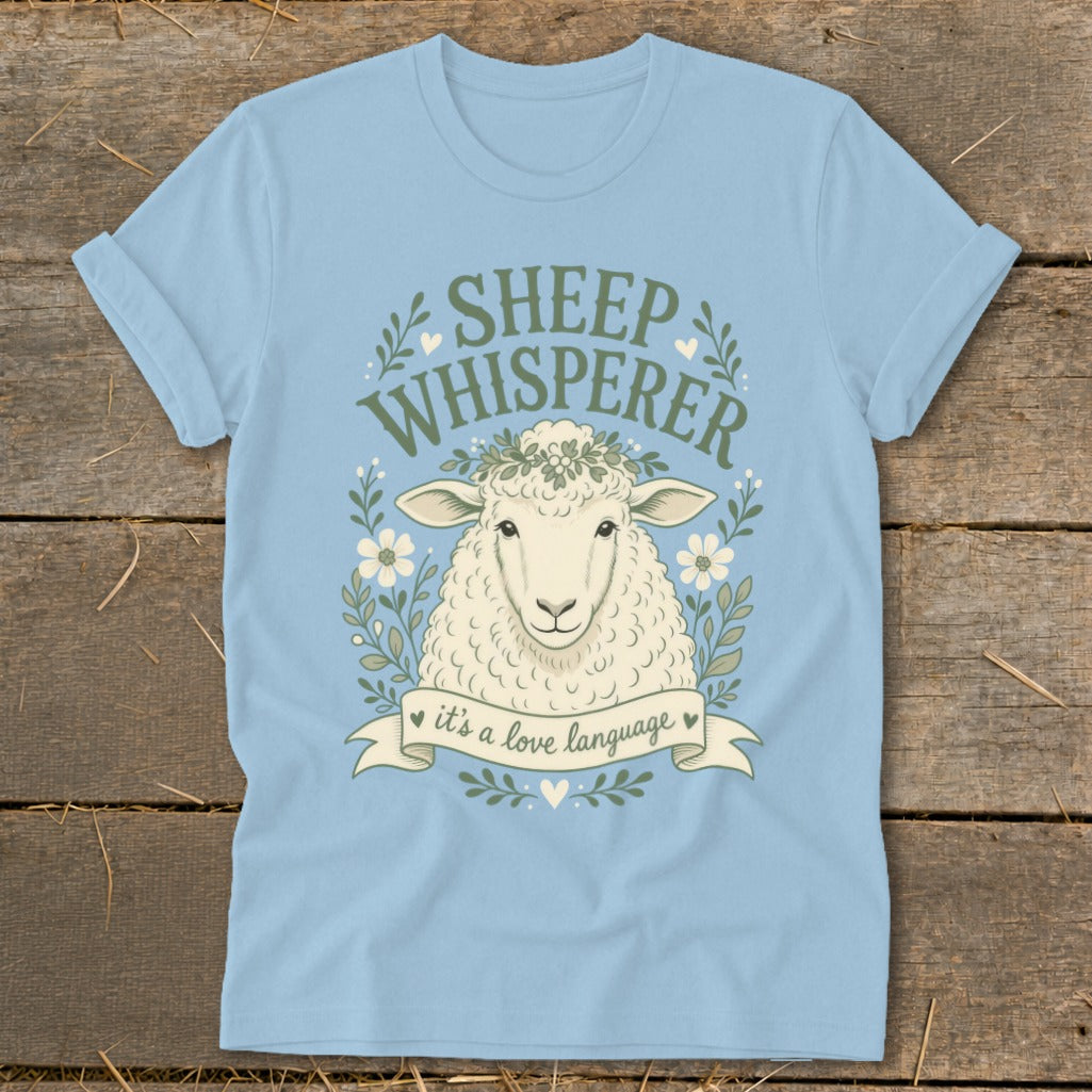 Light blue t-shirt with a sheep and text "Sheep Whisperer, it's a love language."