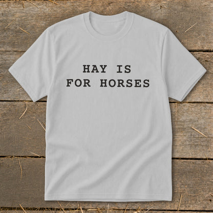 Light gray t-shirt with black text that reads "HAY IS FOR HORSES".