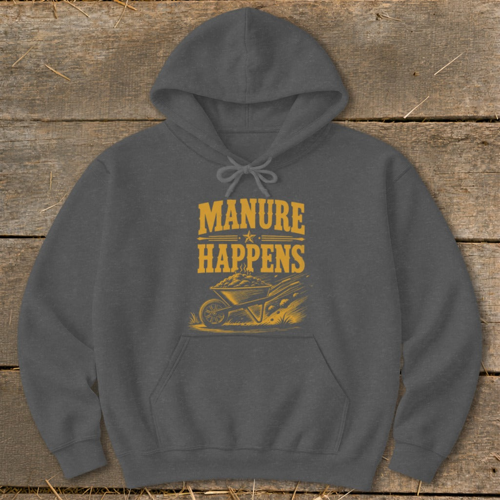 Dark grey hoodie with yellow graphic text "MANURE HAPPENS" and wheelbarrow illustration.
